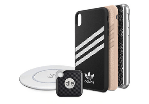 Several phone cases, a phone Tile, and a wireless charger.