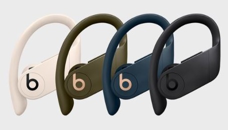 Series of Beats-brand over-the-ear earbuds, aligned in a row.